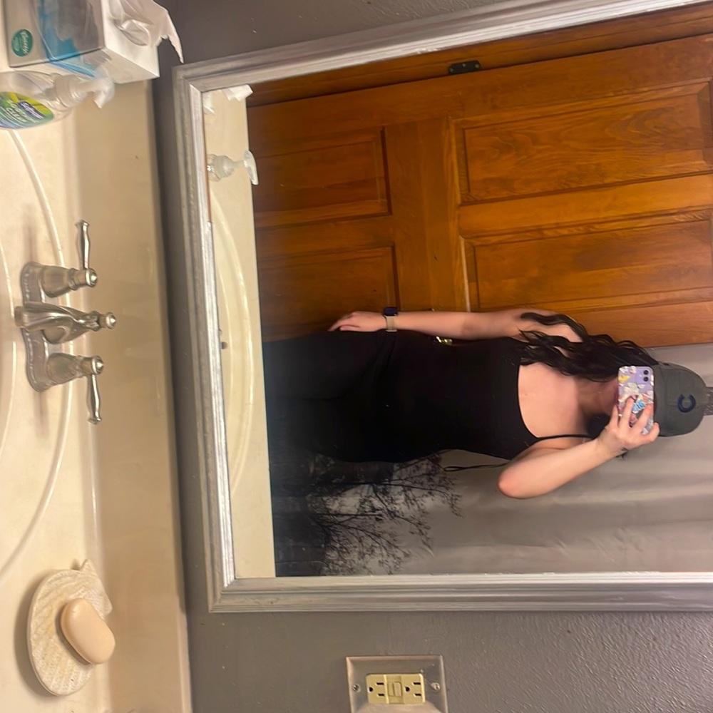 Cute romper black backless. NWOT size small
